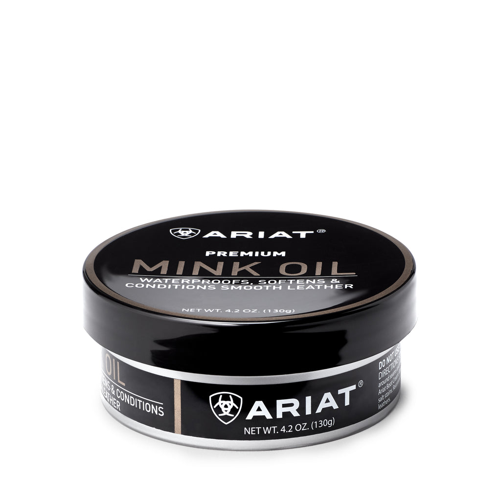 Ariat Premium Mink Oil paste in a round black tin, 4.2 oz container