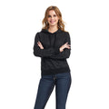Woman wearing a black patterned pullover hoodie with drawstring and ribbed cuffs