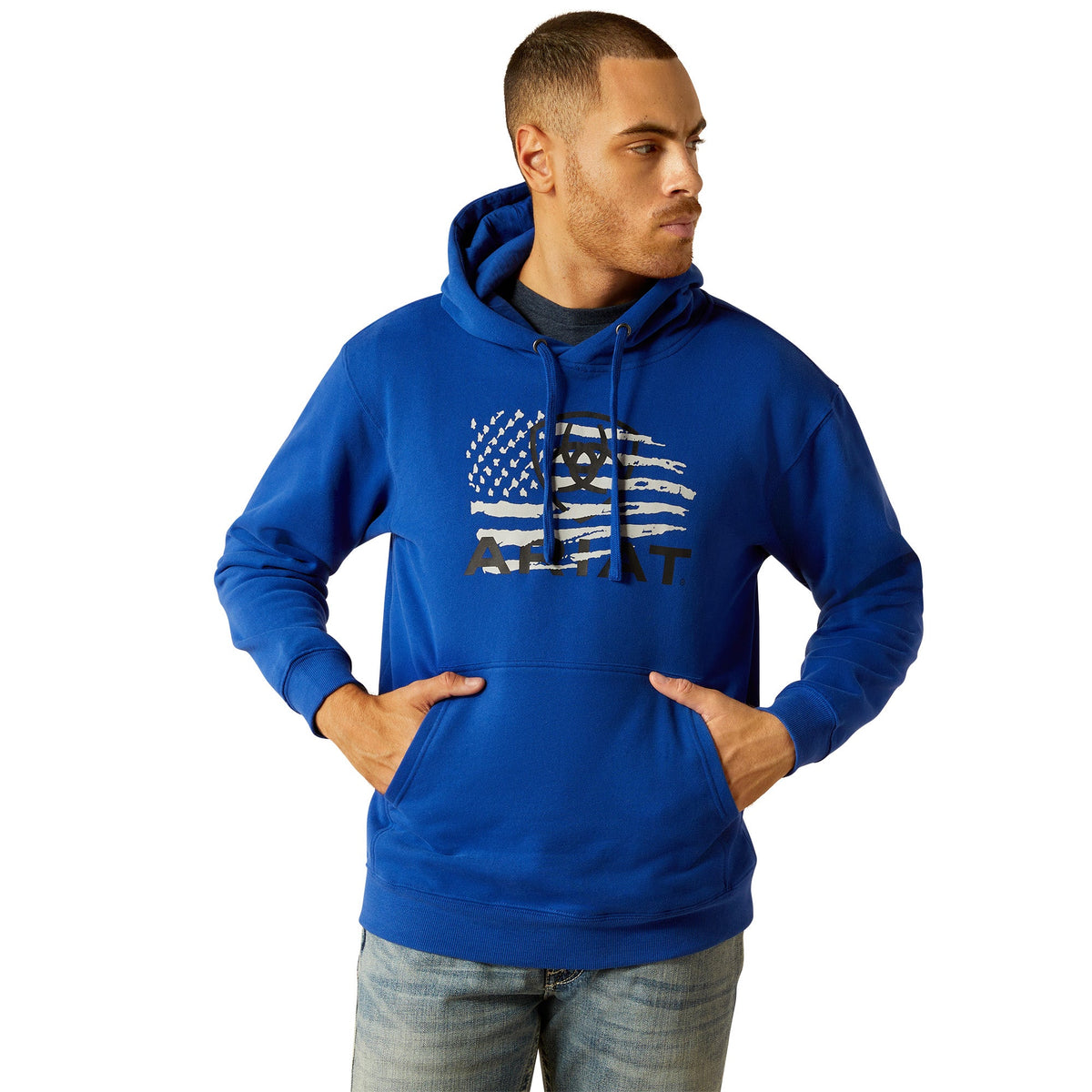 Man wearing Ariat blue pullover hoodie with American flag graphic on chest