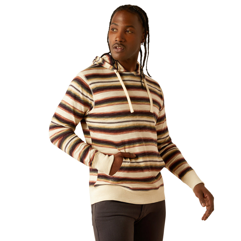 Man wearing a cream multicolor striped pullover hoodie with kangaroo pocket and drawstring