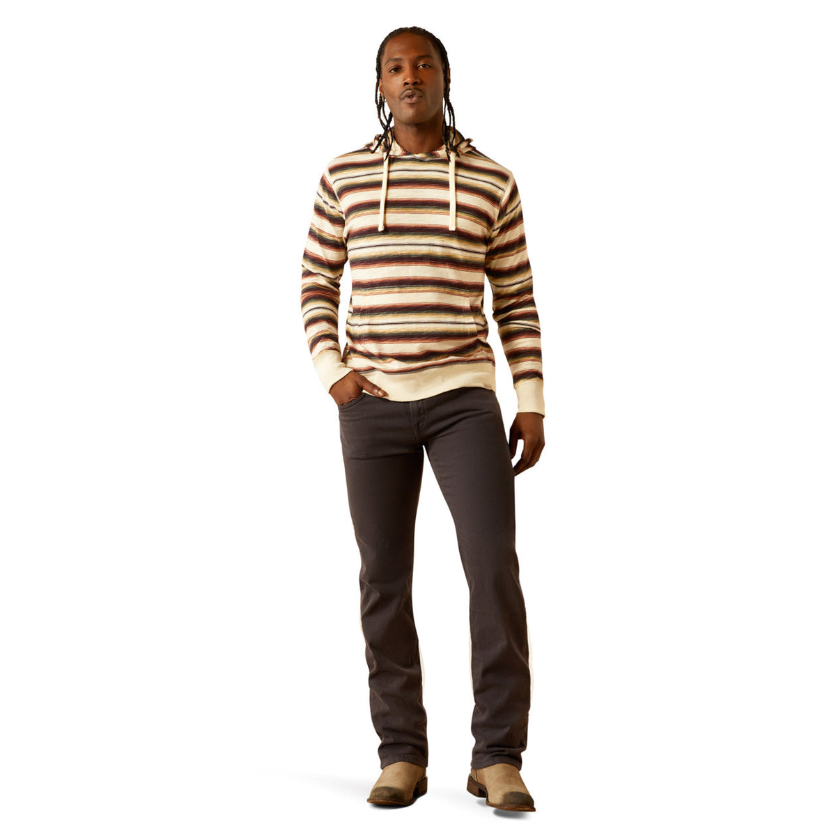 Man wearing a striped lightweight pullover hoodie with drawstrings, dark pants, and boots