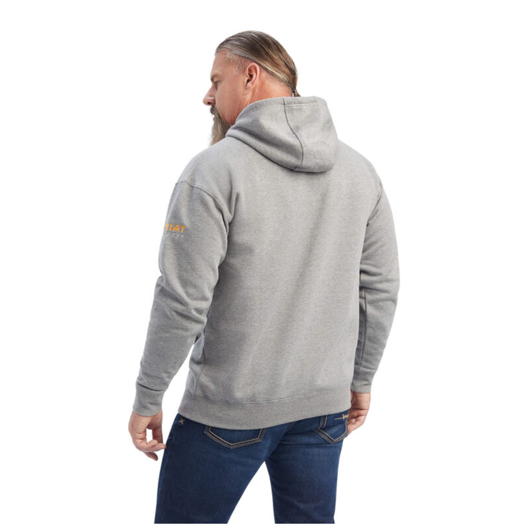 Man wearing grey pullover hoodie with hood up, back view showing Ariat logo on sleeve