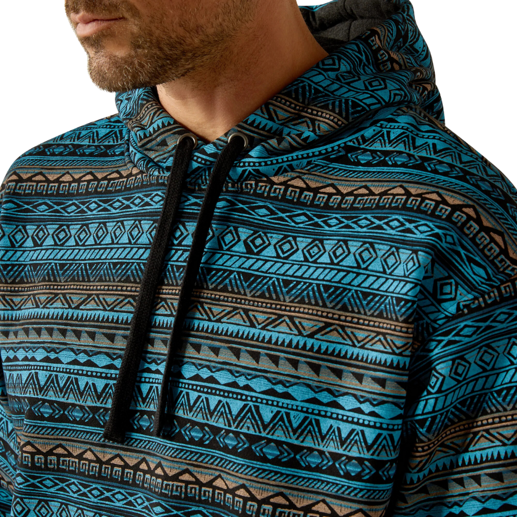 Close-up detail of men's pullover hoodie with Aztec geometric pattern and drawstring