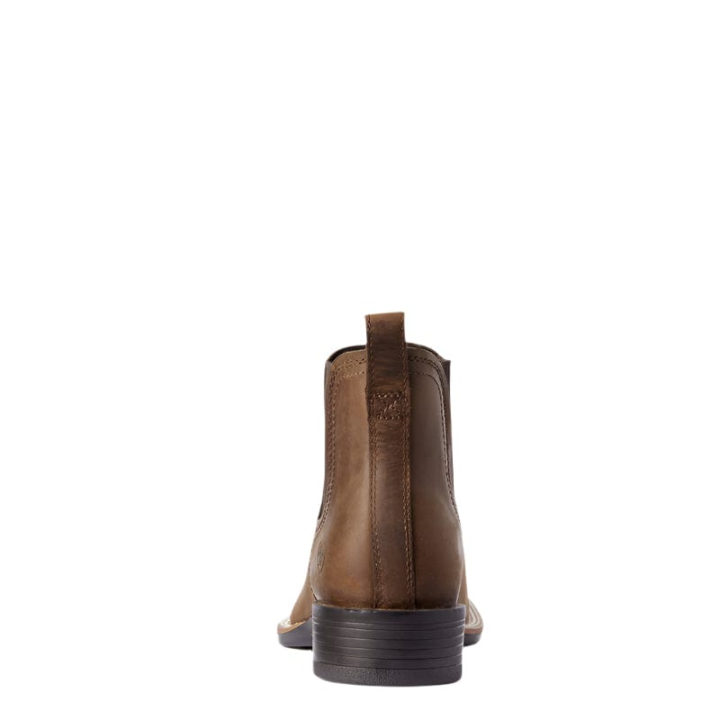 Rear view of a men's brown leather Chelsea ankle boot with pull tab and stacked heel