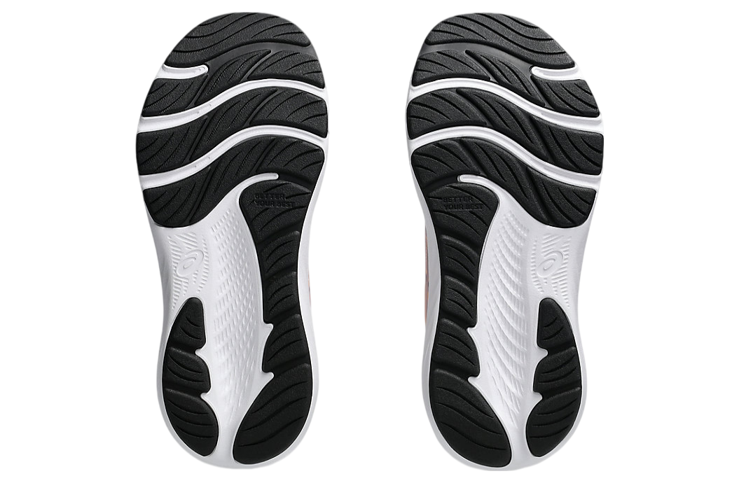 Bottom sole view of a pair of Asics girls running shoes showing outsole tread pattern