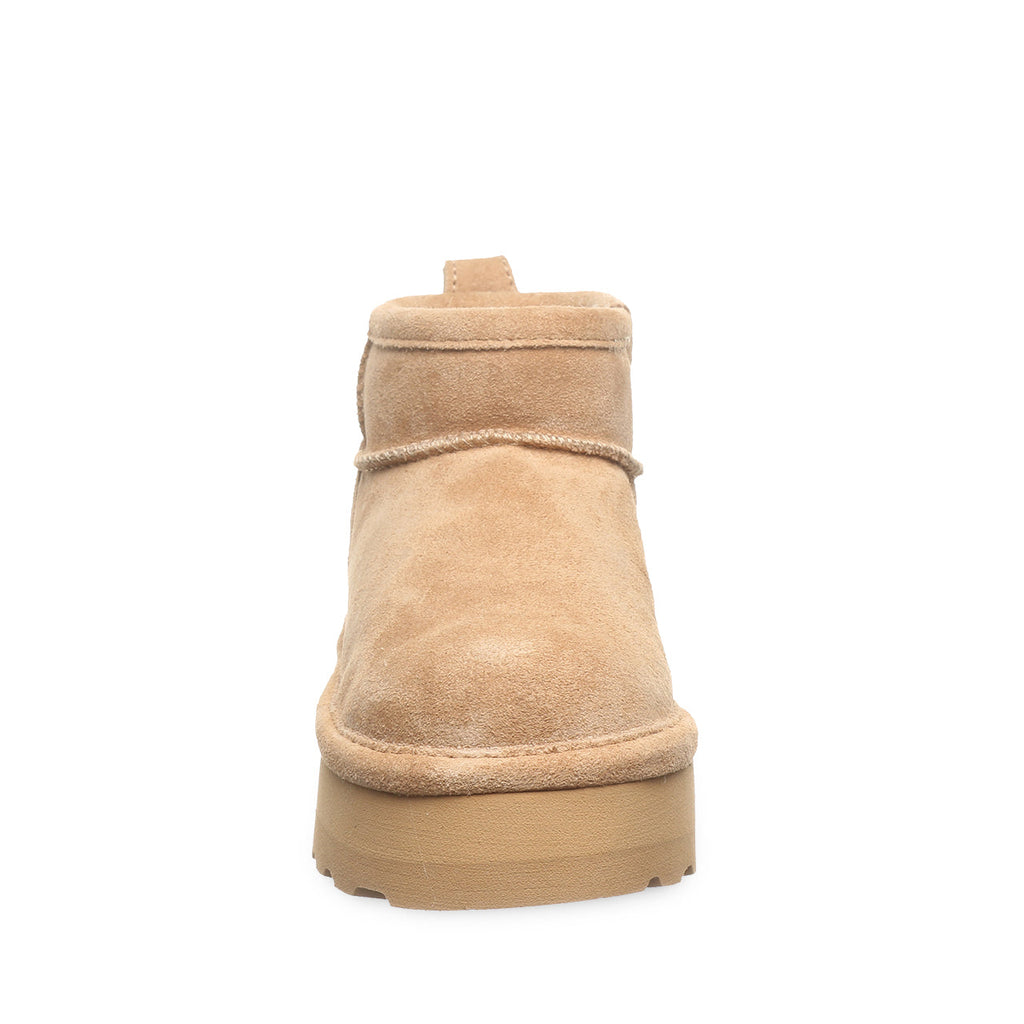 Back view of a short suede ankle boot with chunky platform sole and pull tab