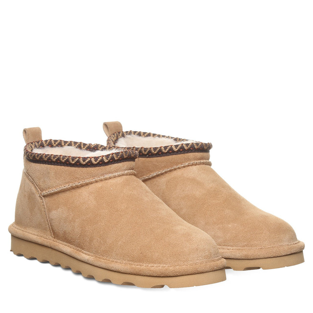 Pair of women's ultra-short suede ankle boots with sherpa lining and decorative knit collar trim