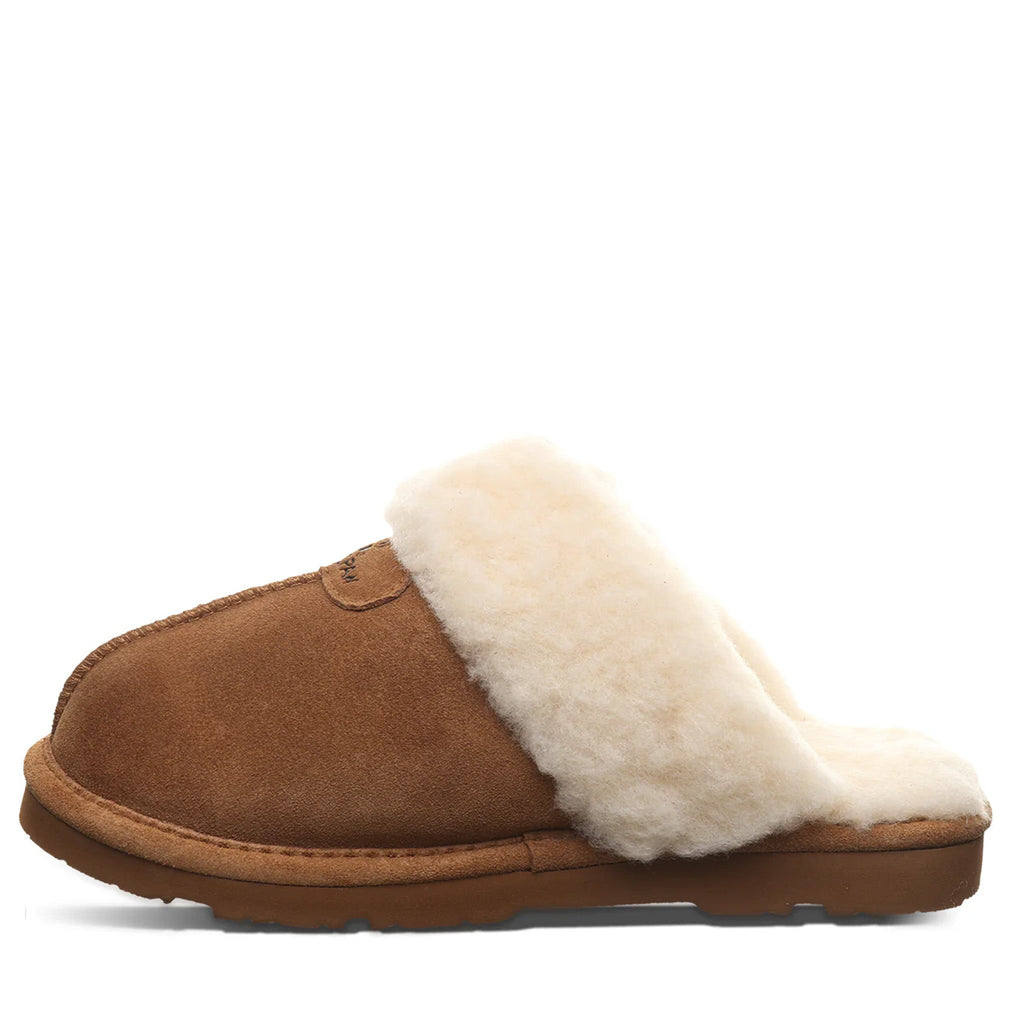 Bearpaw women's slip-on mule slipper with tan suede upper and fluffy cream shearling lining
