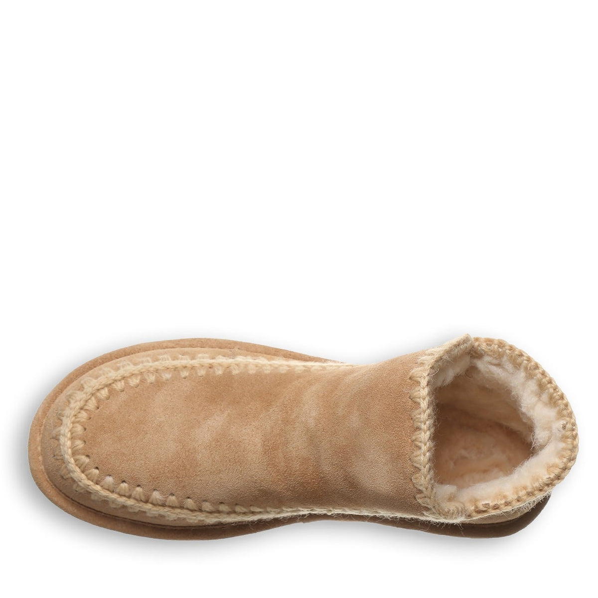 Top-down view of a sherpa-lined suede ankle boot with braided trim detail