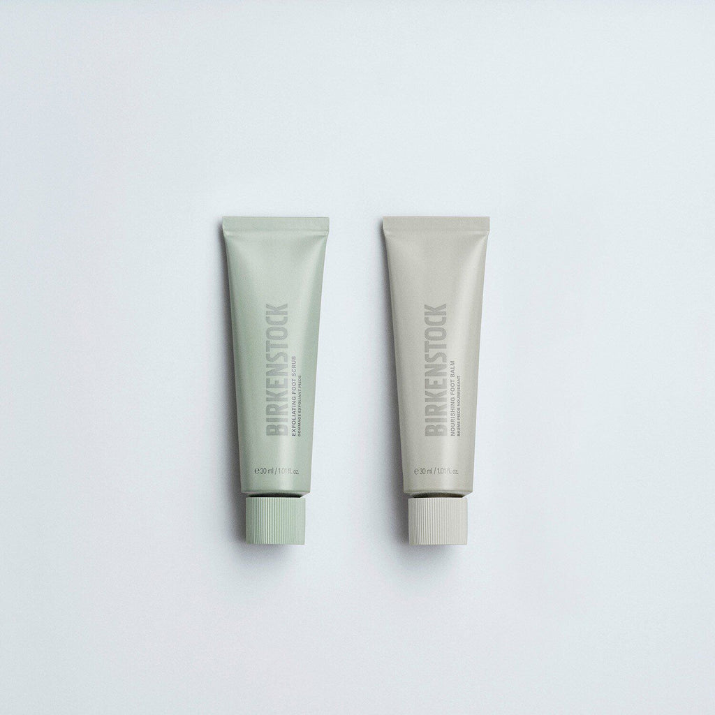 Birkenstock Exfoliating Foot Scrub and Nourishing Foot Balm tubes side by side