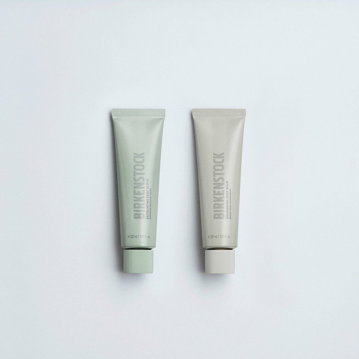 Birkenstock Exfoliating Foot Scrub and Nourishing Foot Balm tubes side by side
