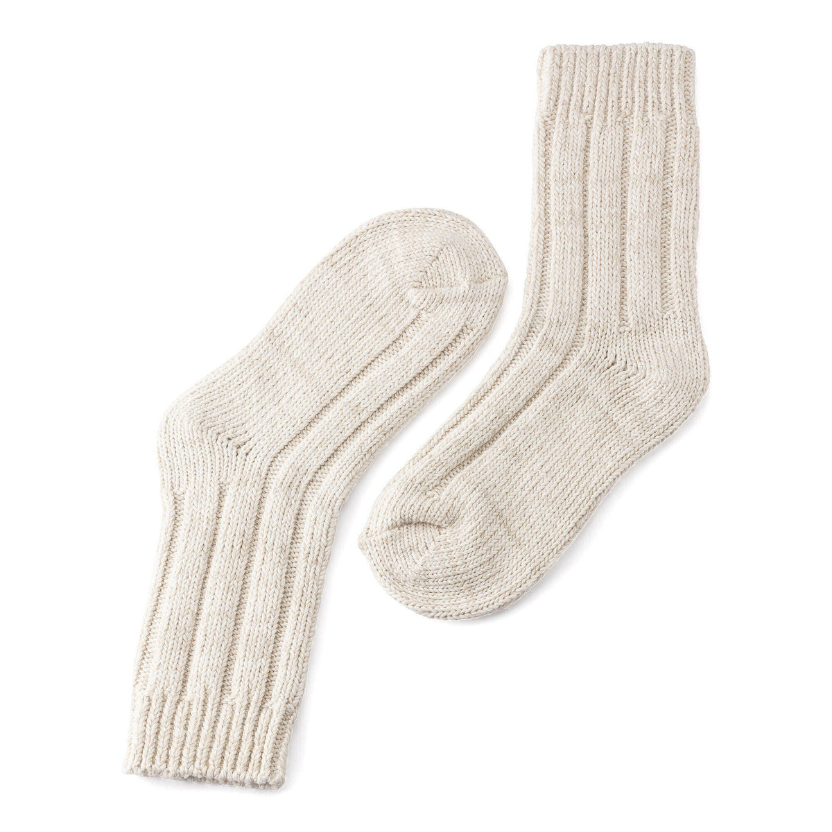 Pair of chunky ribbed knit cotton crew socks laid flat on white background