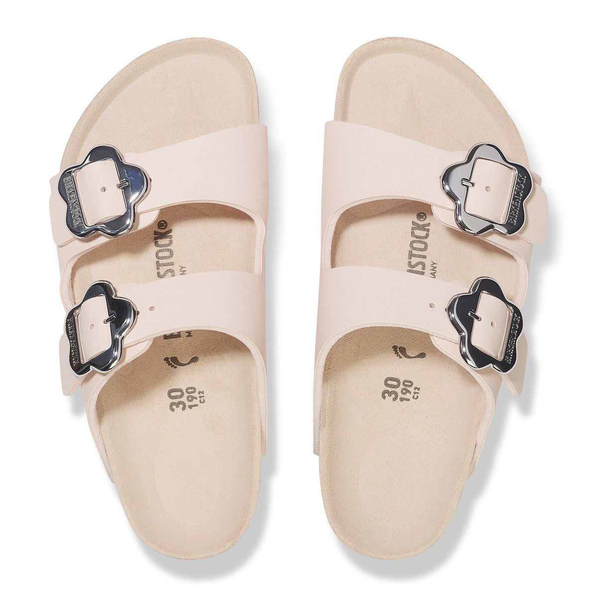 Kids Birkenstock Arizona sandals with flower-shaped silver buckles, top-down view