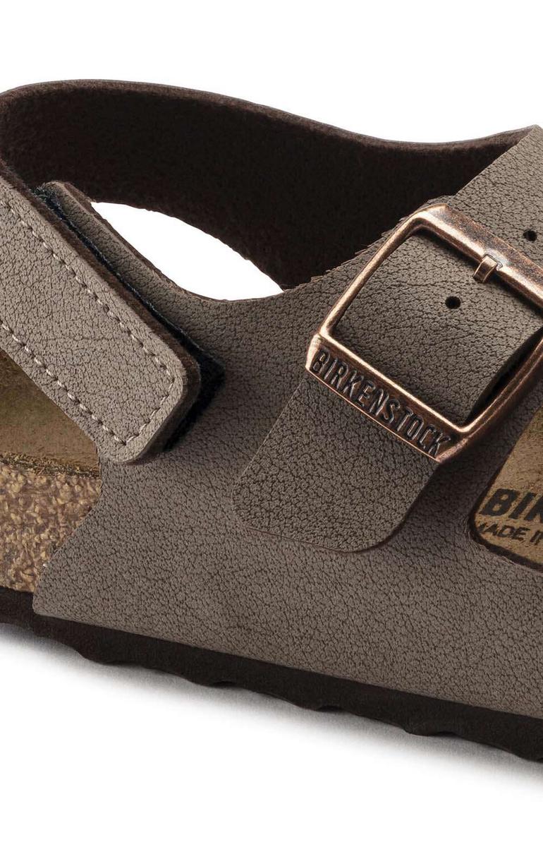 Birkenstock kids sandal close-up showing buckle strap detail and contoured cork footbed