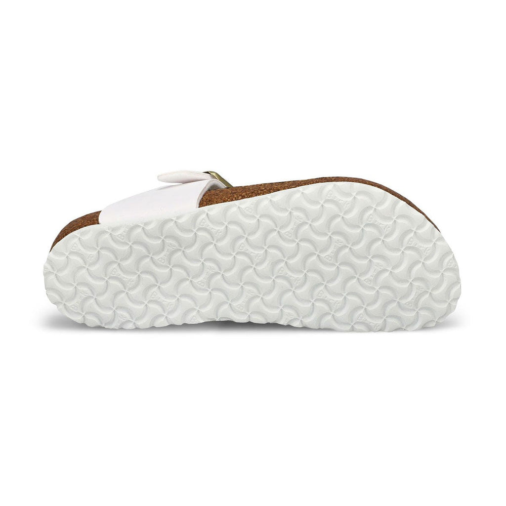 Bottom sole view of a white Birkenstock kids sandal showing textured EVA outsole and cork footbed
