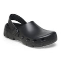 Birkenstock closed-toe clog with heel strap, buckle closure, and chunky textured sole