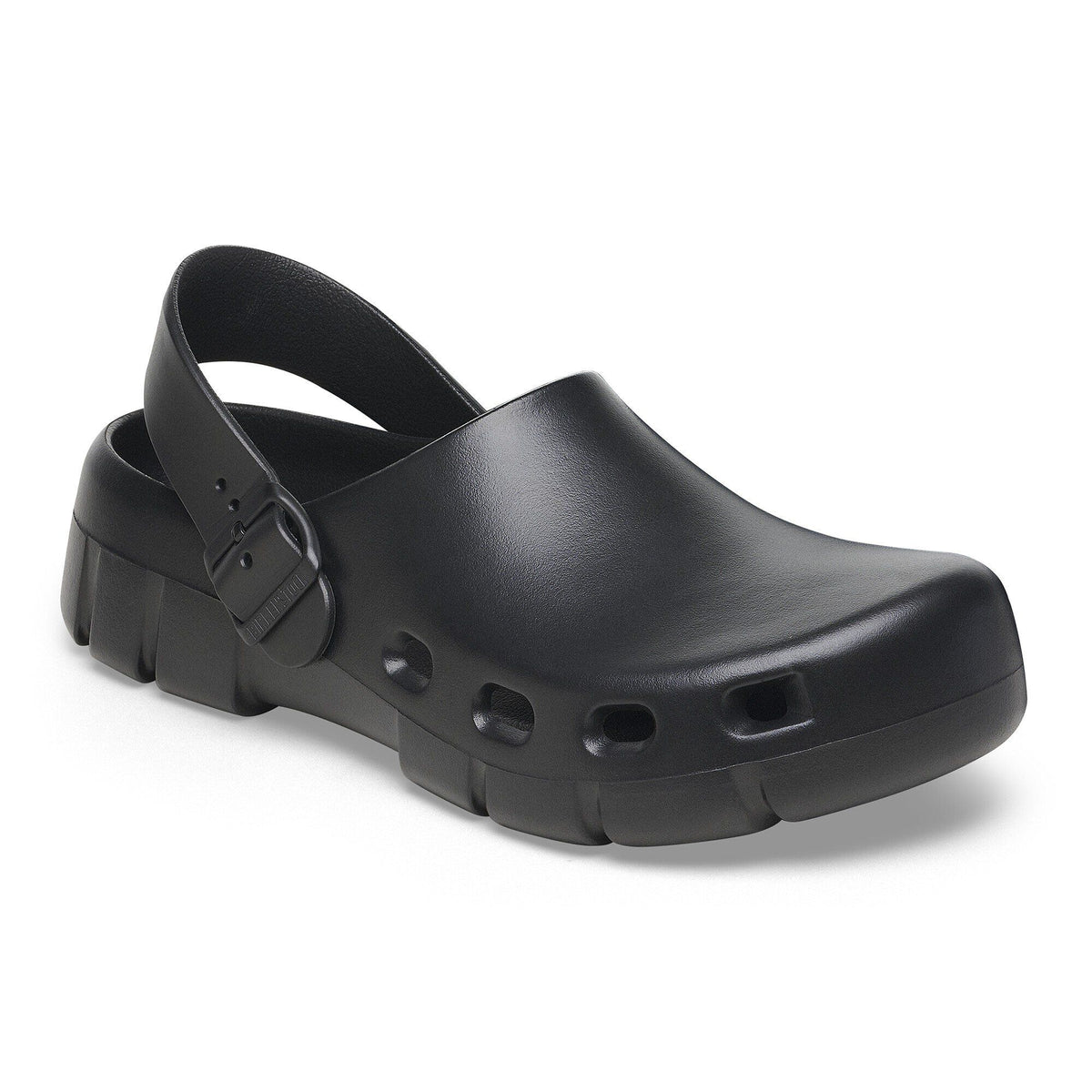 Birkenstock closed-toe clog with heel strap, buckle closure, and chunky textured sole