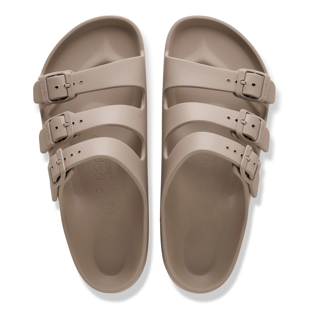 Top-down view of a pair of three-strap EVA platform sandals with adjustable buckles