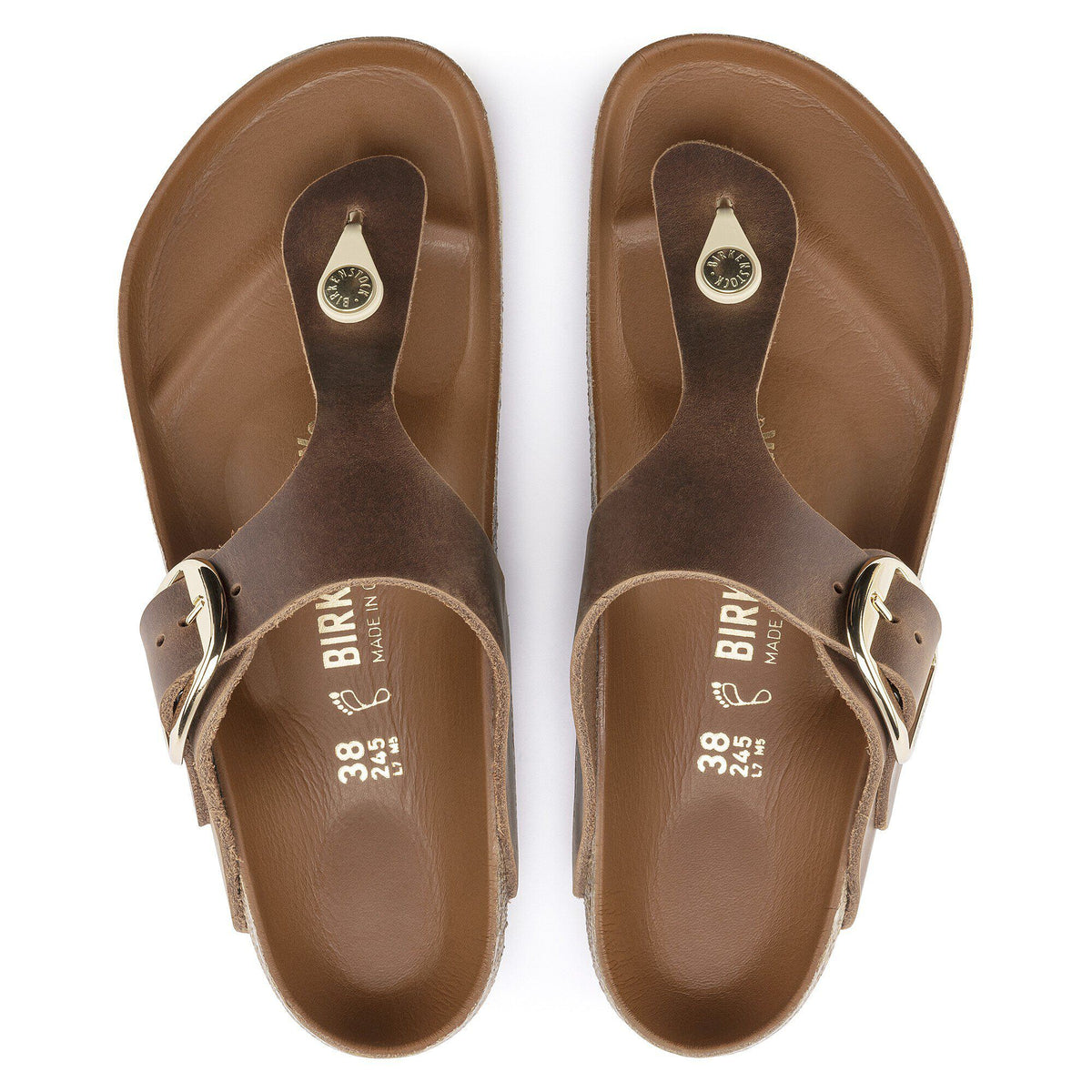 Birkenstock Gizeh thong sandals with large gold buckle, top-down view showing both sandals