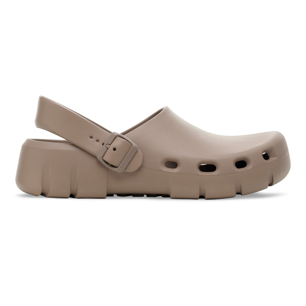 Birkenstock slingback clog with ventilation holes, buckle strap, and chunky platform sole