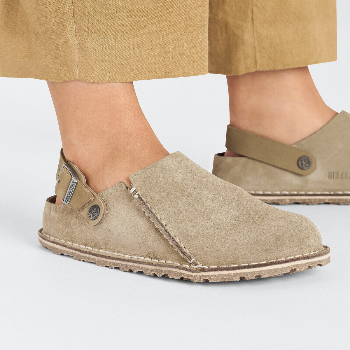 Birkenstock Lutry suede slip-on shoe with ankle strap shown on model's feet