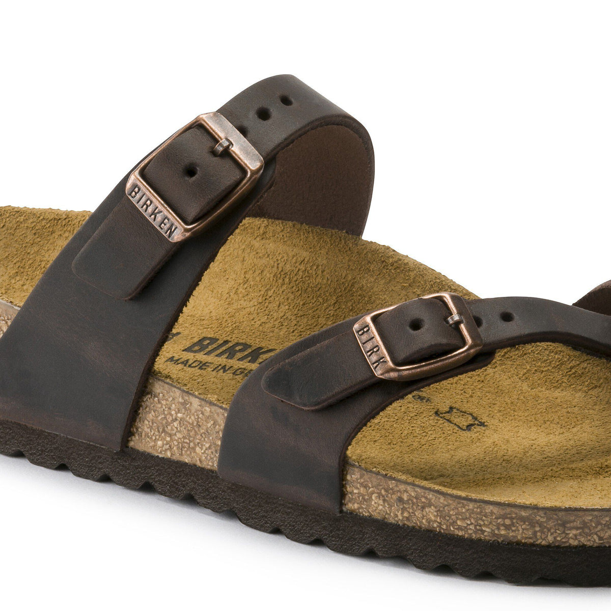 Close-up detail of Birkenstock Mayari sandal showing two adjustable leather straps with copper buckles and contoured footbed