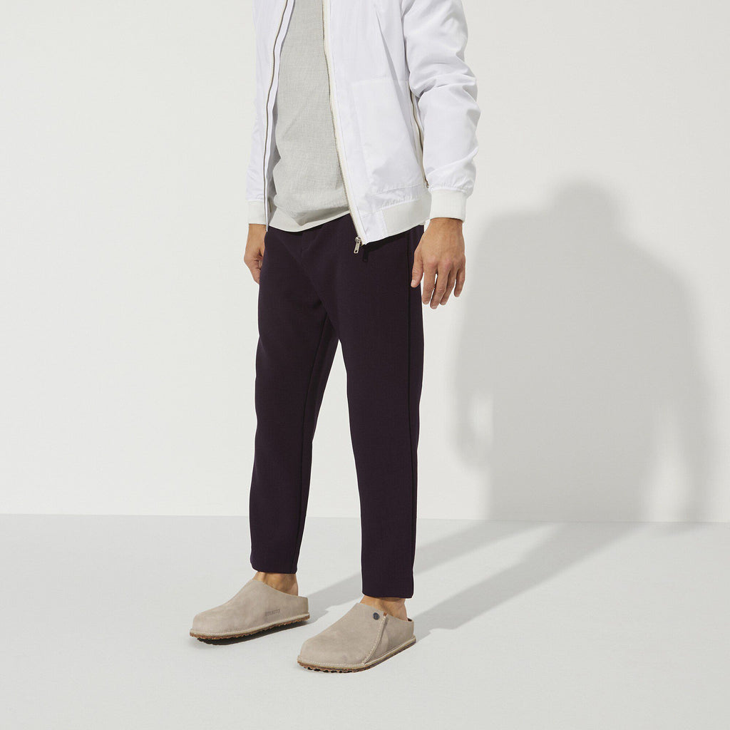 Model wearing Birkenstock Zermatt 365 Premium suede slip-on clogs with taupe tone