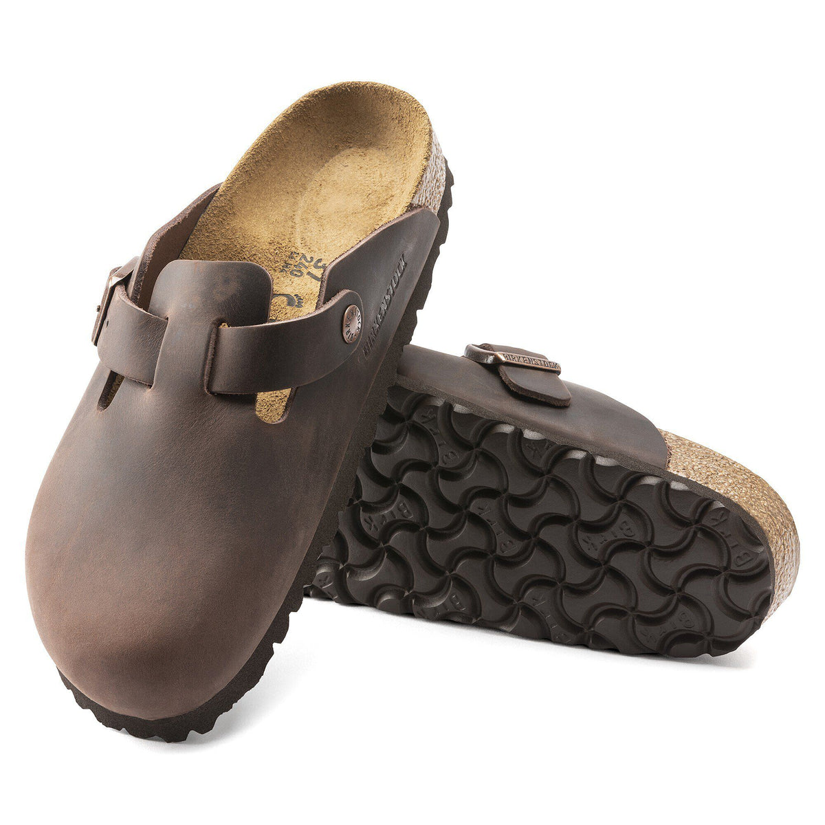Birkenstock Boston oiled leather clogs shown as a pair, one displaying the footbed and sole