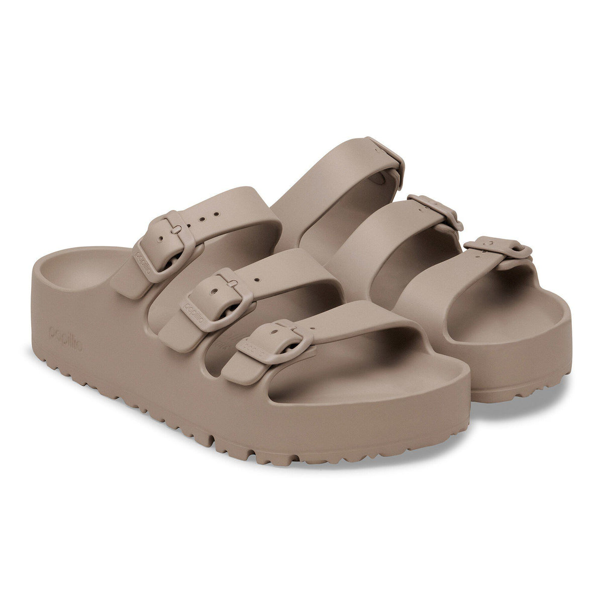 Pair of platform EVA slide sandals with two adjustable buckle straps on chunky sole
