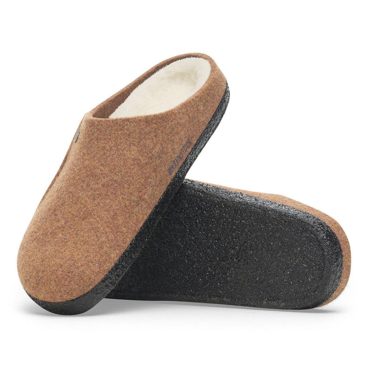 Pair of felt wool clog slippers with shearling lining and dark rubber sole