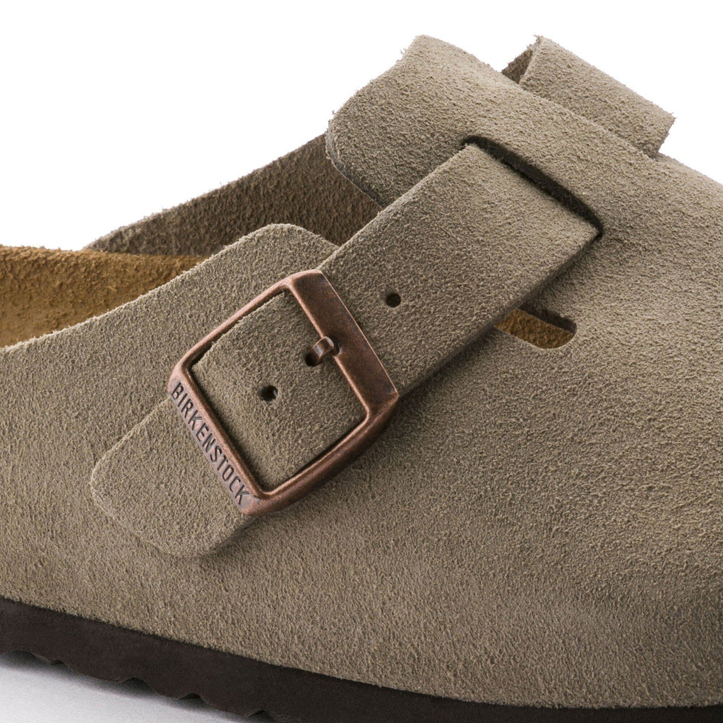 Close-up detail of Birkenstock Boston suede clog showing copper buckle and strap