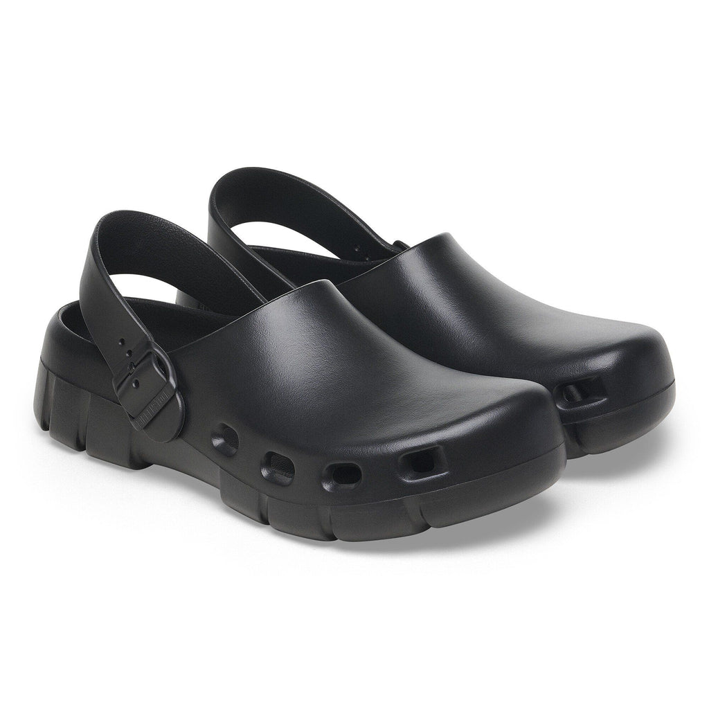Pair of Birkenstock slingback clogs with buckle strap and ventilation holes on sole