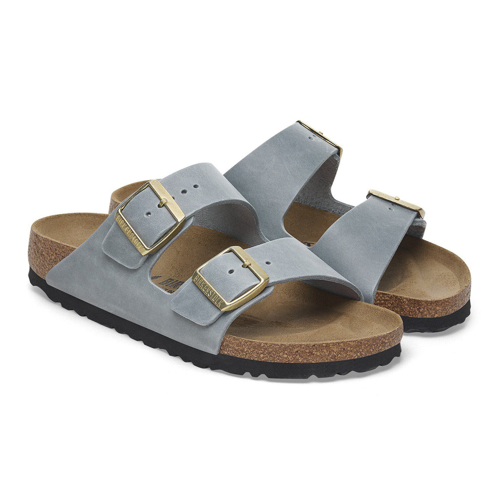Birkenstock Arizona sandals with two adjustable gold buckle straps and cork footbed