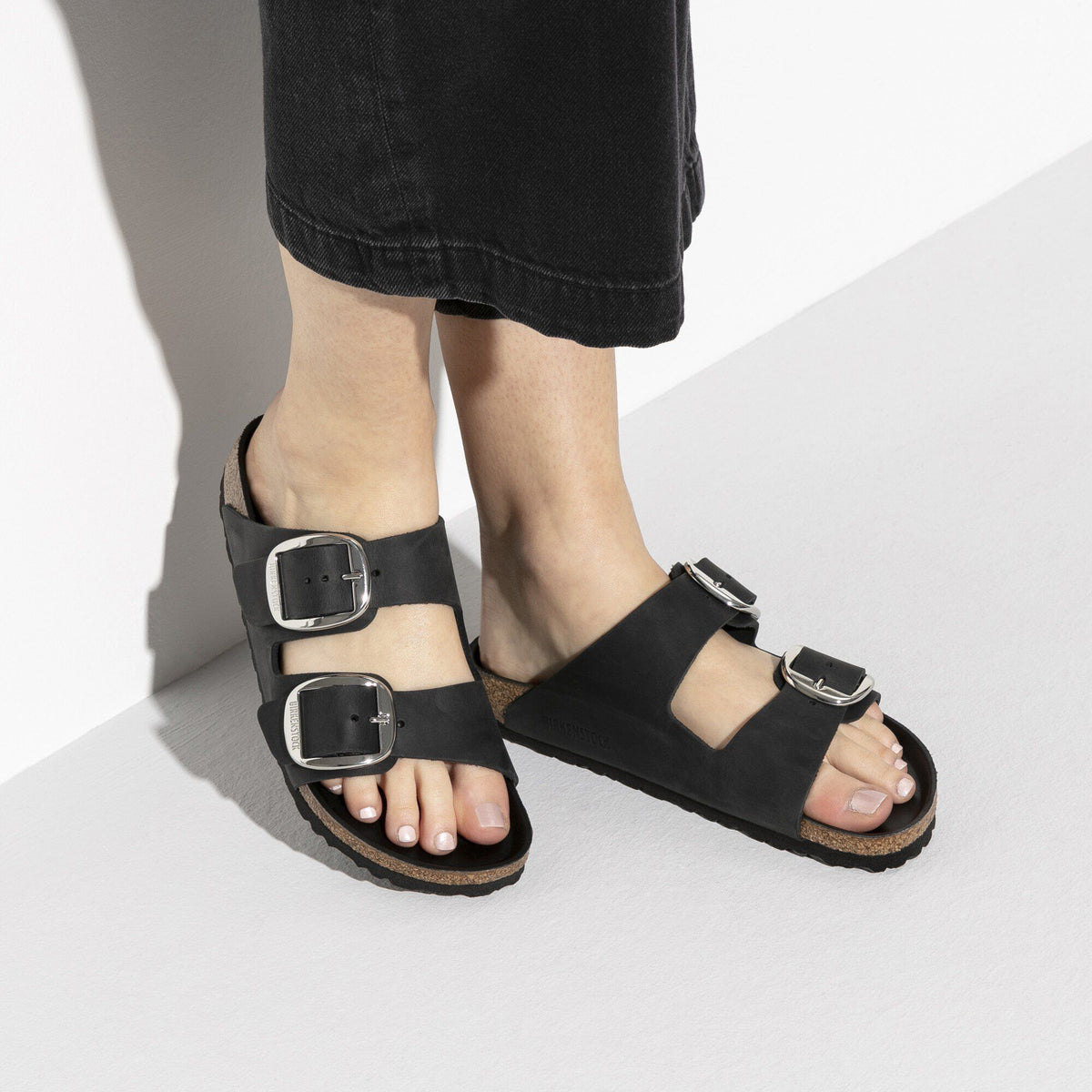 Birkenstock Arizona Big Buckle sandals worn with black midi skirt, open-toe view