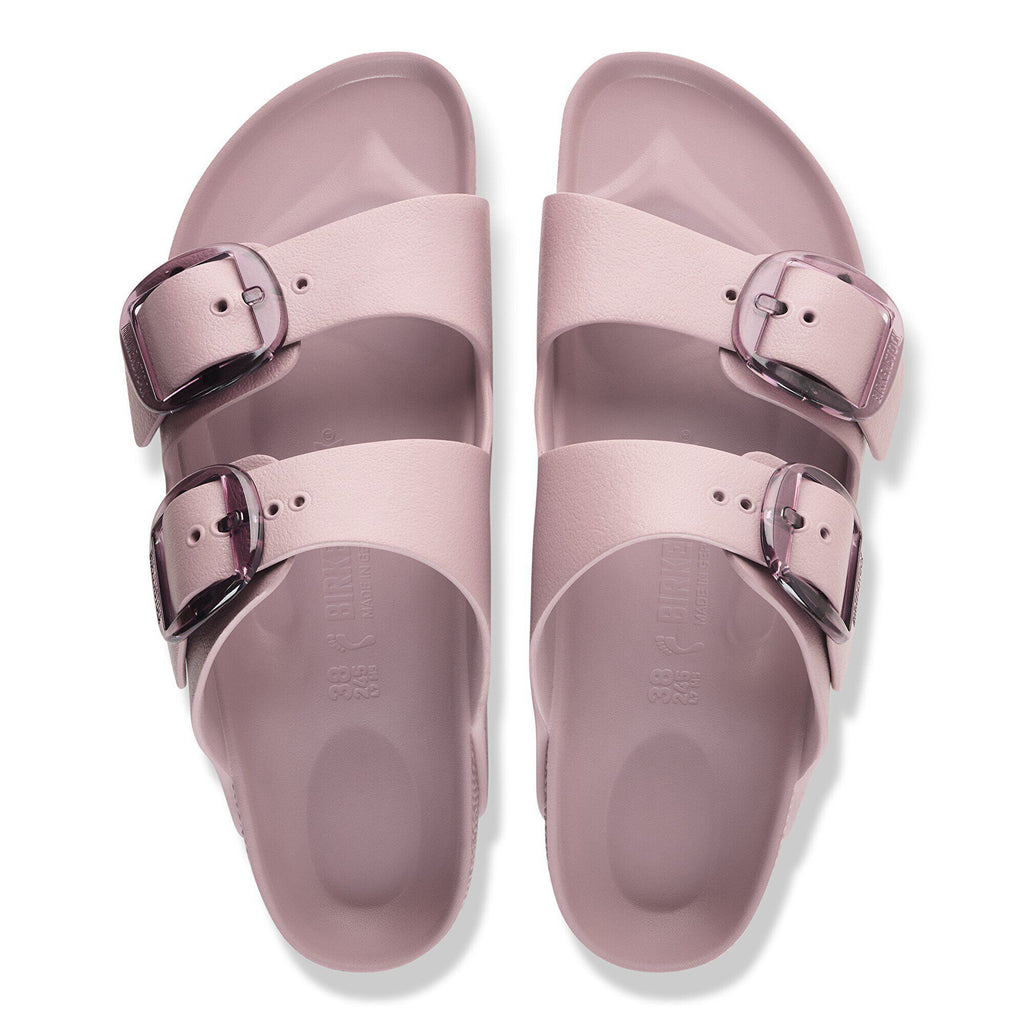 Top-down view of a pair of Birkenstock Arizona EVA sandals with large buckles on white background