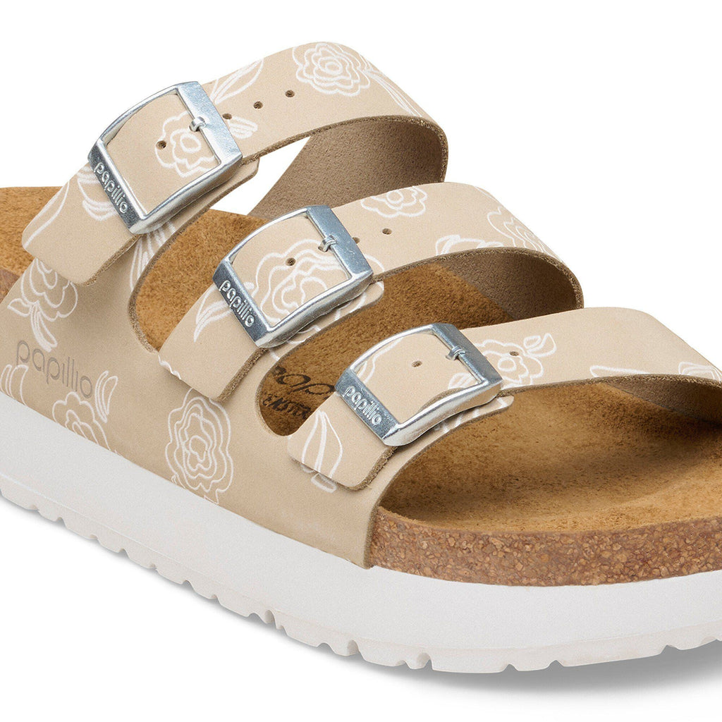 Birkenstock Papillio three-strap platform sandal with white floral pattern and silver buckles