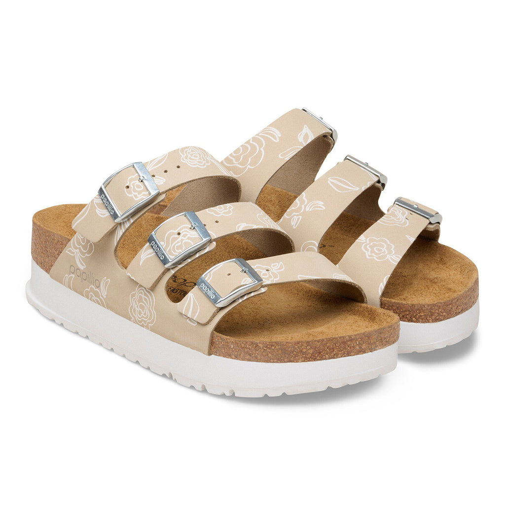 Birkenstock Papillio platform sandals with three buckle straps and white floral rose pattern