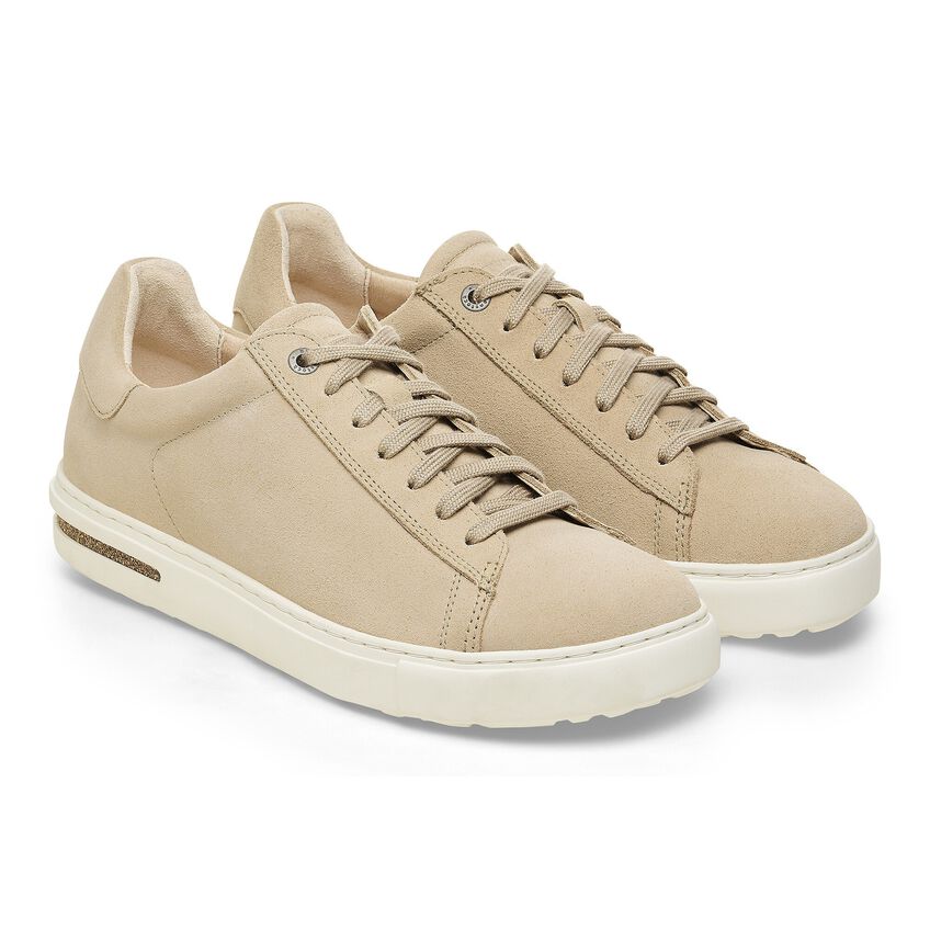 Pair of women's lace-up low-top suede leather sneakers with white rubber sole