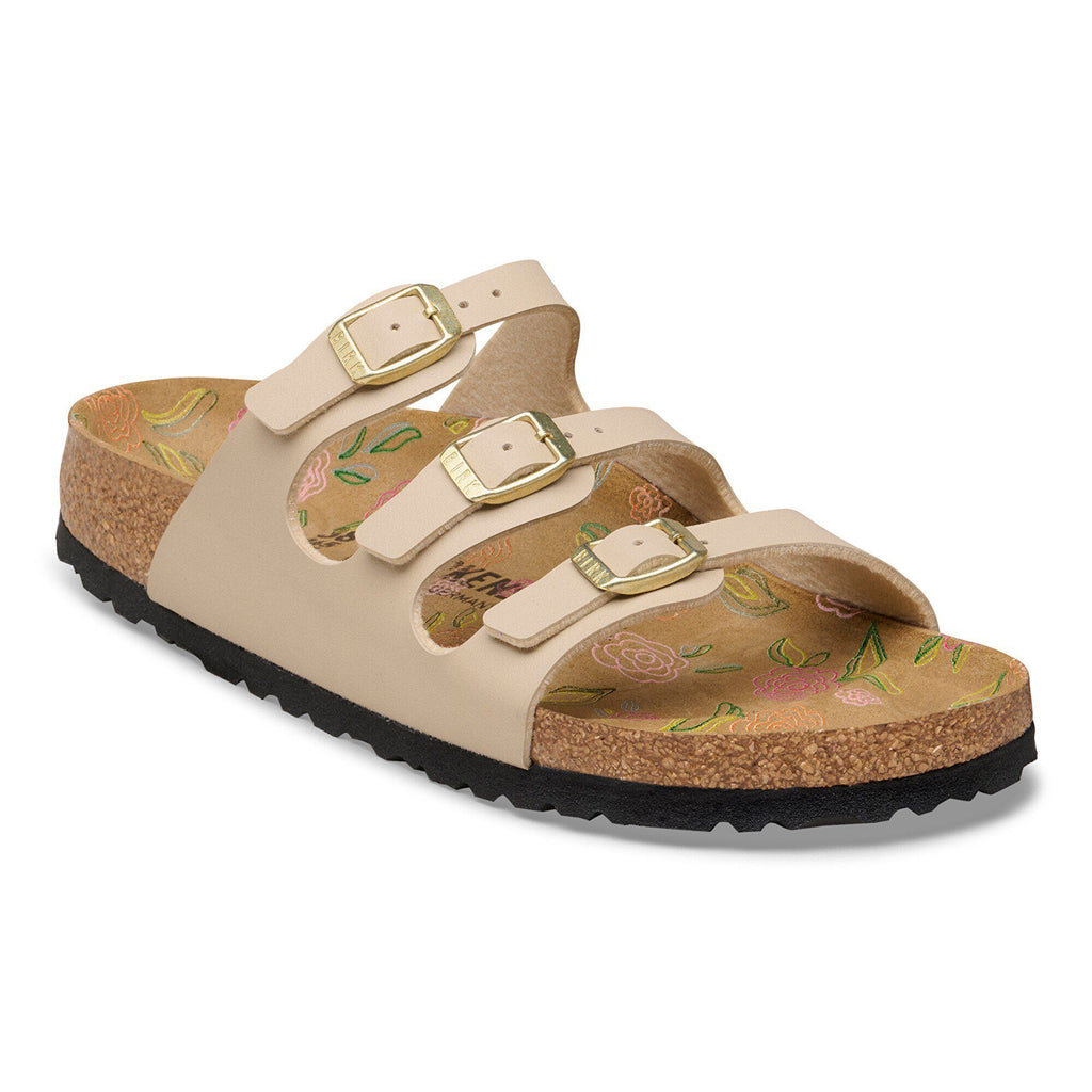 Birkenstock Florida three-strap sandal with cork footbed and gold buckles on white background