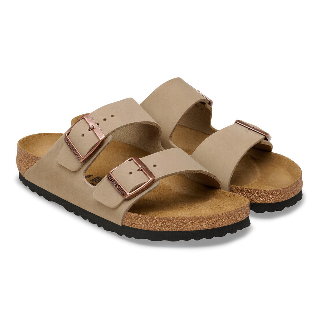 Birkenstock Arizona two-strap sandals with cork footbed and copper buckles, angled pair view