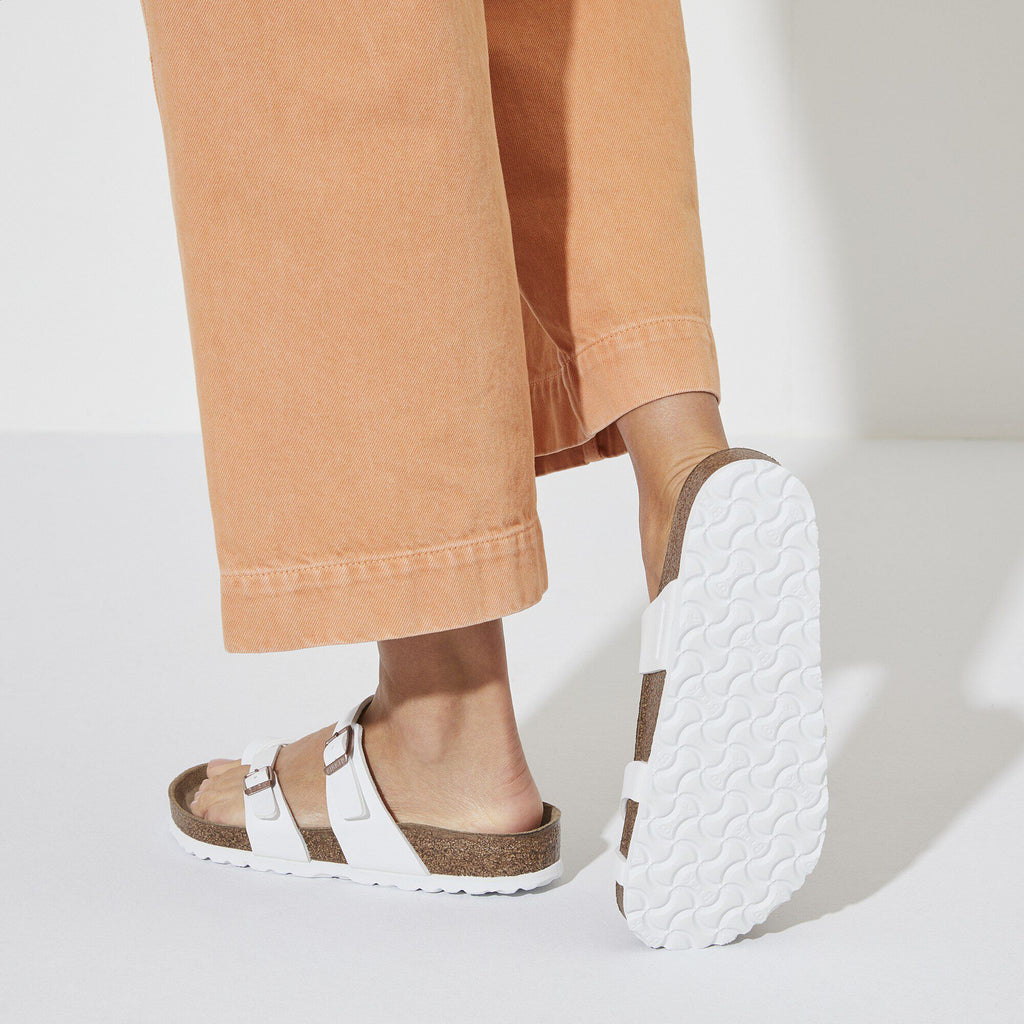 Birkenstock Mayari sandals worn with cropped orange trousers showing sole detail