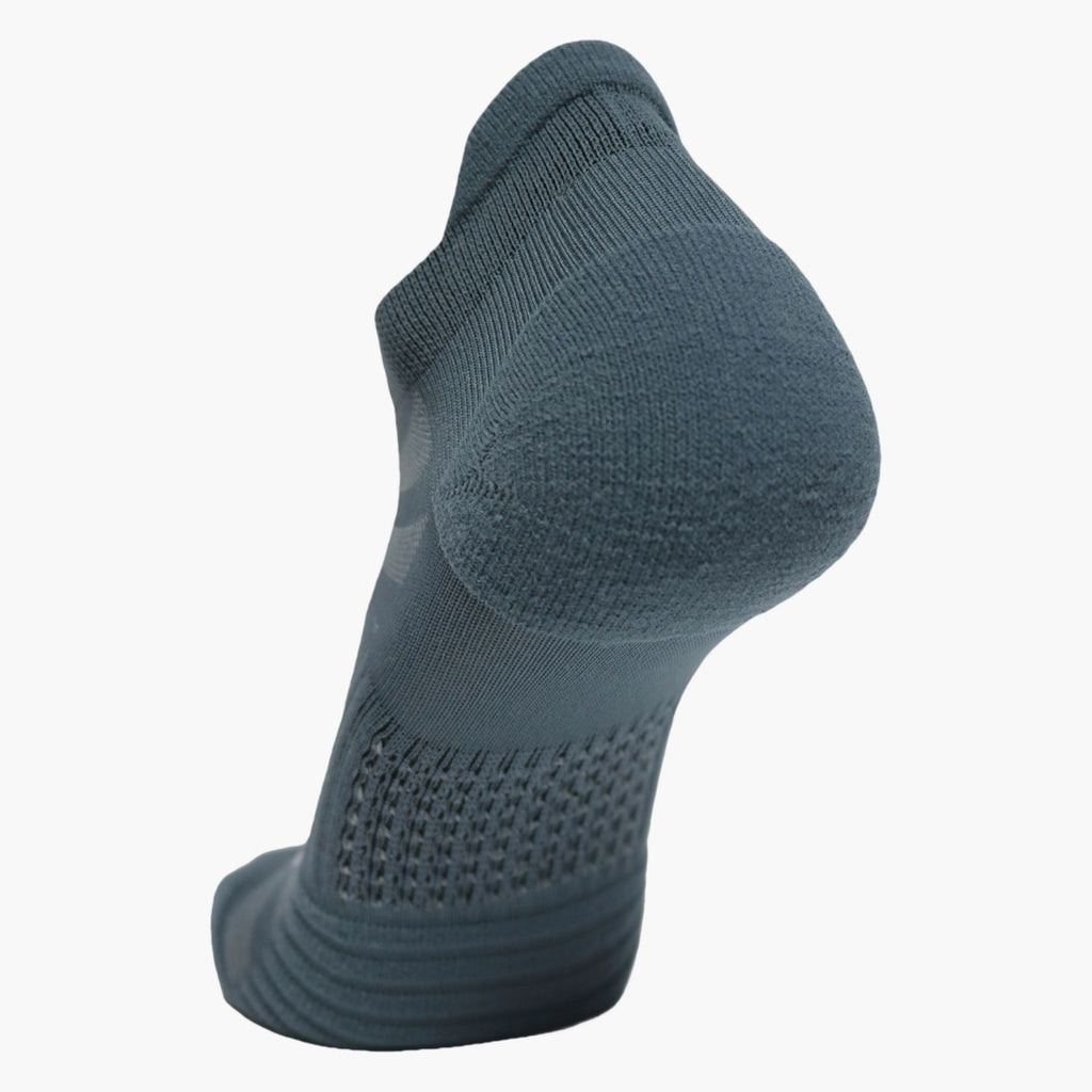 Brooks Ghost Lite no-show sock shown from rear angle on foot form highlighting heel cushioning