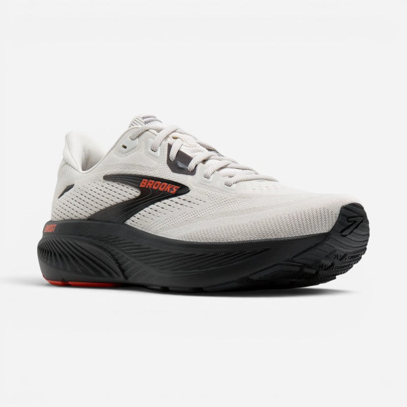 Brooks Ghost running shoe with white mesh upper, black midsole, and orange accent details