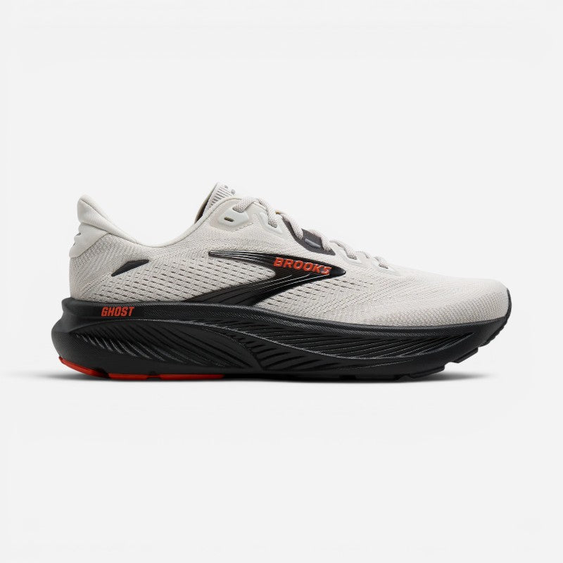 Brooks Ghost men's running shoe with white mesh upper, black cushioned sole, and orange accents