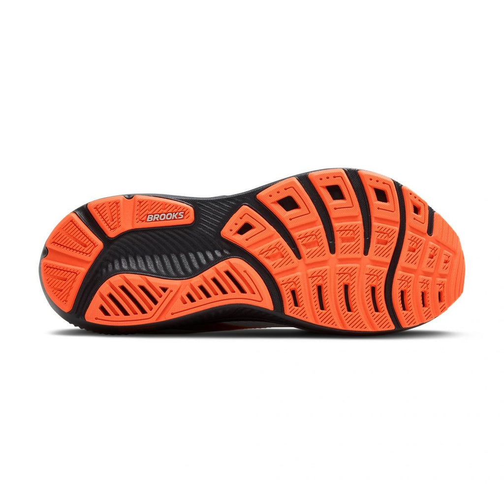 Bottom sole view of Brooks Ghost 17 running shoe showing orange and black outsole tread pattern
