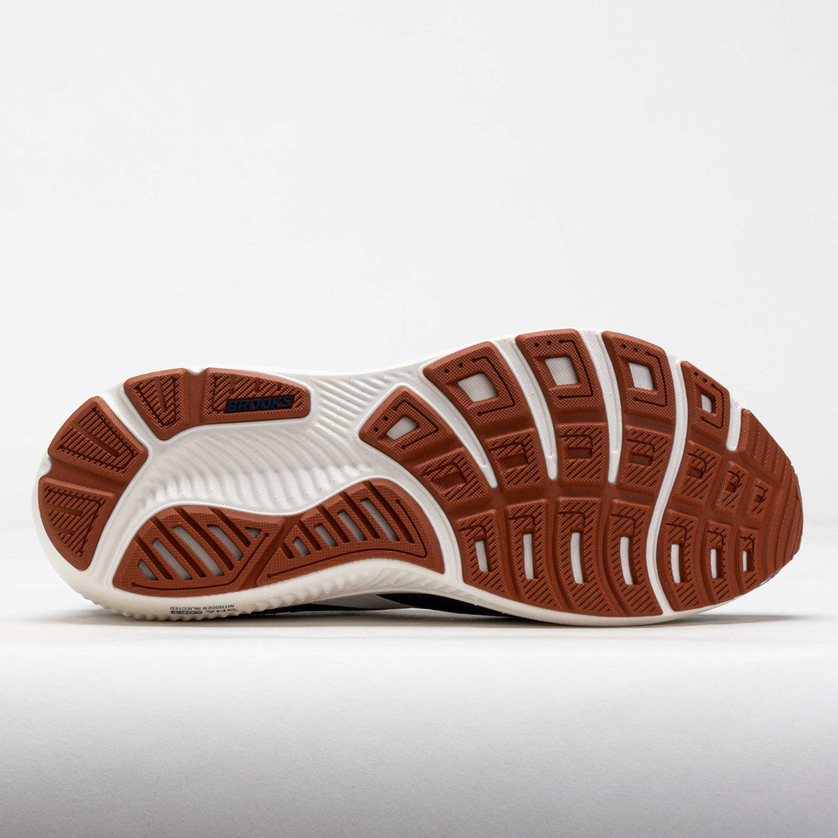 Bottom view of Brooks Ghost 18 running shoe showing segmented rubber outsole tread pattern