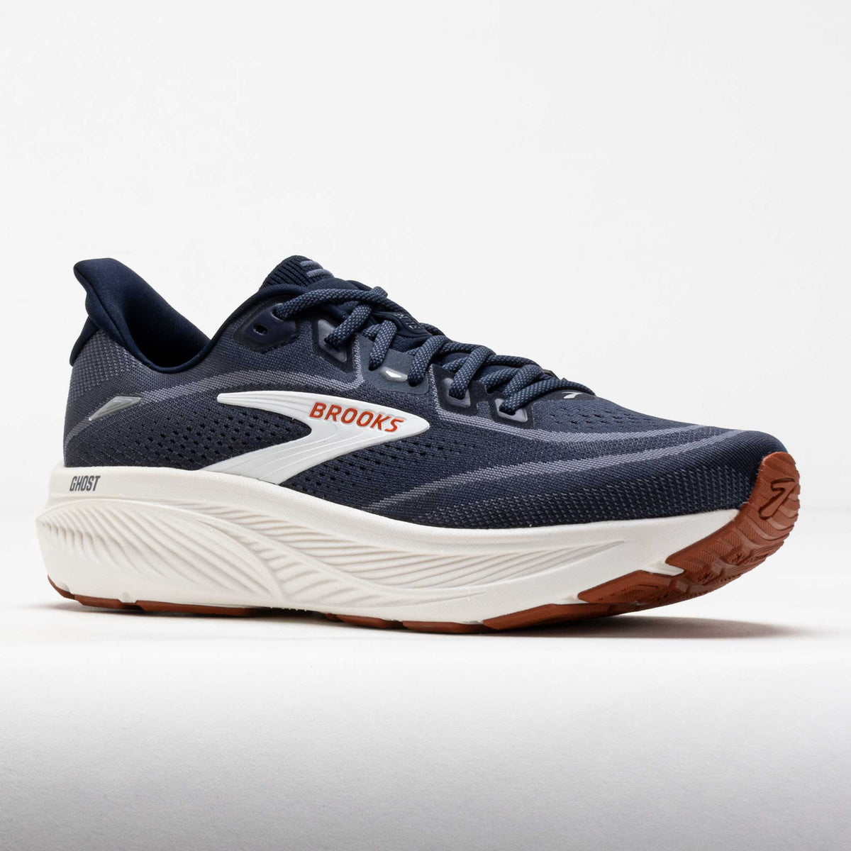 Brooks Ghost running shoe in navy blue with white midsole and rust gum outsole, lateral view