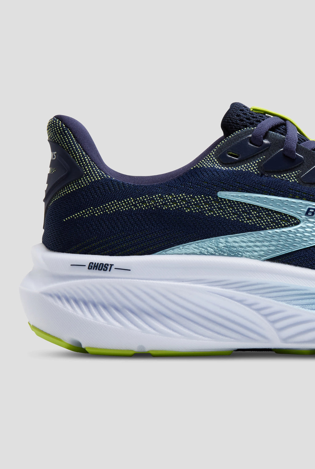Close-up heel detail of Brooks Ghost running shoe with navy upper and white midsole