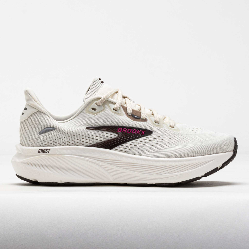Brooks Ghost running shoe in off-white with black logo and pink brand lettering, lateral view