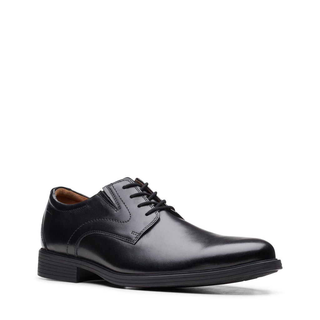 Clarks men's plain toe leather Oxford dress shoe with lace-up closure, angled side view